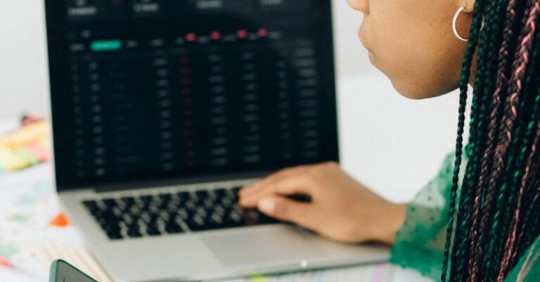 IPOs - Boy in Green and Black Shirt Using Macbook Pro