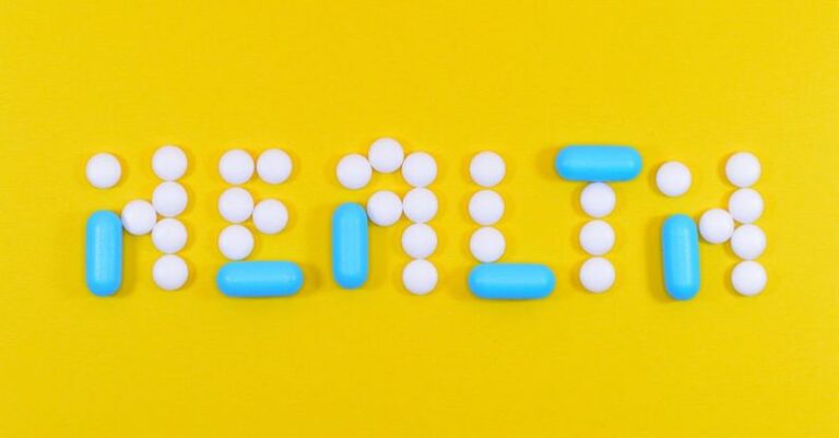 Health - White and Blue Health Pill and Tablet Letter Cutout on Yellow Surface